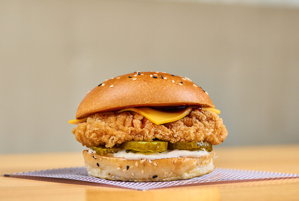 The BBQ Buk Chicken Burger by YOMG ~ crunchy fried chick’n, cheese, bread & butter pickles, texan BBQ, buttermilk ranch