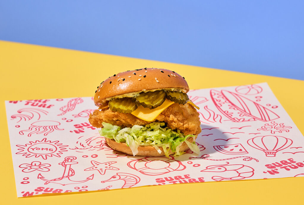 Fish Royale Burger from YOMG ~ golden crumbed fresh fish, cheese, shredded iceberg lettuce, bread and butter pickles, secret sauce