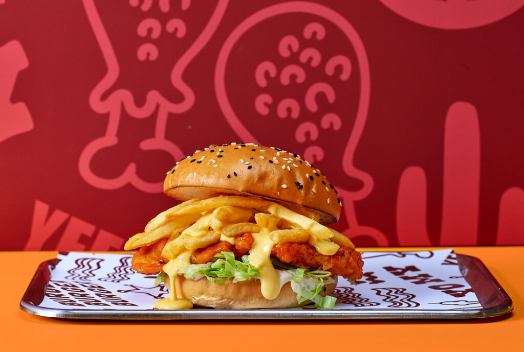 Cheesy Buffalo Chick'n Sandwich #YOMGLimited Menu by YOMG ~ hot buffalo crunch chick’n, shoestring fries, cheese sauce, shredded iceberg lettuce, buttermilk ranch