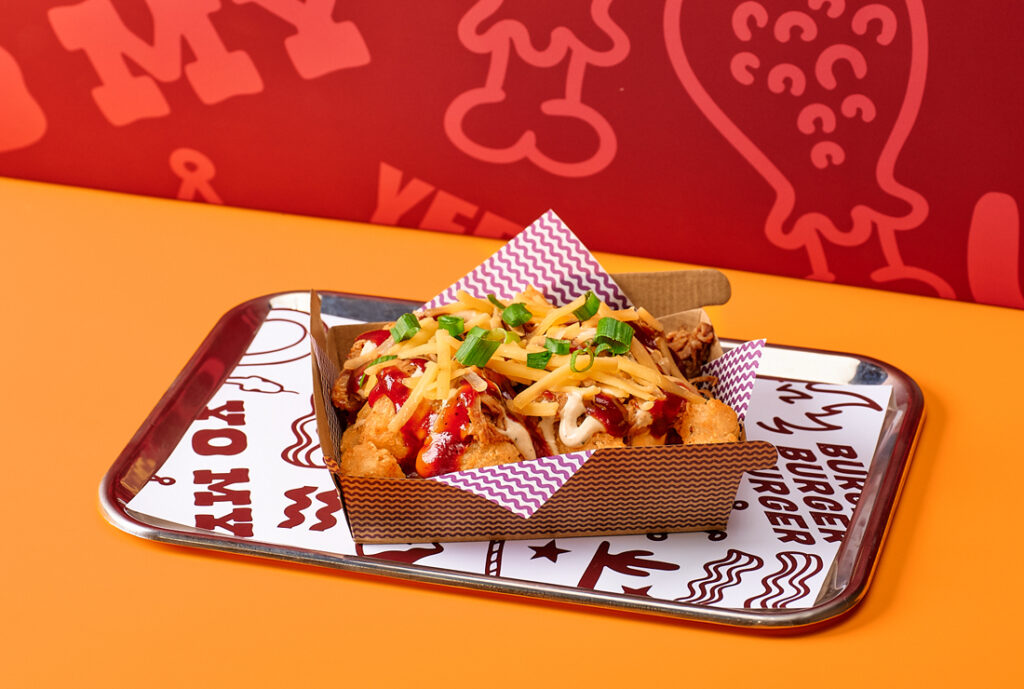 Hillbilly Tots Side #YOMGLimited Menu by YOMG ~ slow cooked pulled pork, cheese sauce, buttermilk ranch, sweet baby ray’s smokey BBQ sauce, shredded tasty cheese, spring onion, secret seasoned tater tots