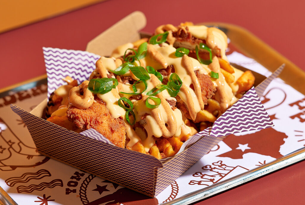 Loaded Waffle Fries #YOMGlimited Menu by YOMG ~ secret seasoned waffle fries, crunchy chicken texan tender, buttermilk ranch, cheese sauce, roadhouse mayo, spring onion
