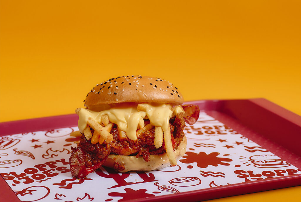 Sloppy Buk Burger by YOMG ~ southern fried chicken, bacon, sloppy joe sauce, secret seasoned shoestring fries, cheese sauce, southern mayo #YOMGlimited Menu