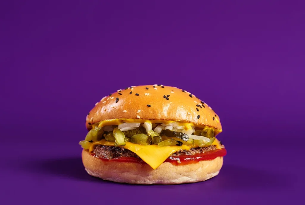 YOMG Cheesy Cheeseburger Menu Item - beef, cheese, onion, pickles, ketchup, american mustard