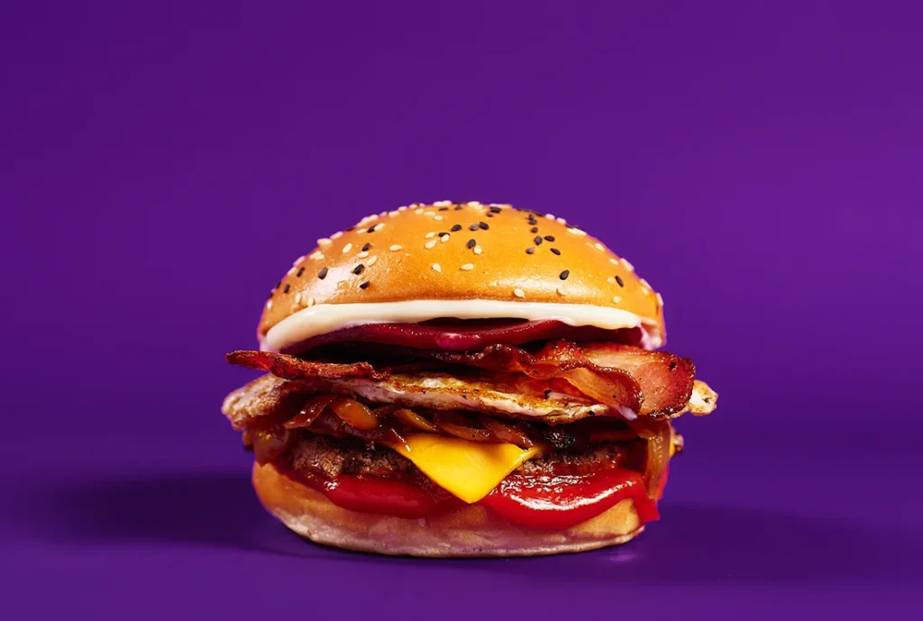 YOMG True Blue Angus Beef and Bacon Burger Menu Item - beef, cheese, bacon, egg, beetroot, caramelized onion, ketchup, mayo