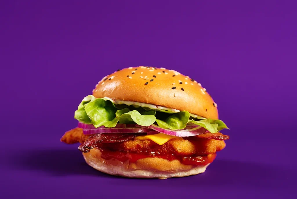 YOMG Winner Winner Chicken Schnitzel Burger Menu Item - chicken schnitzel, cheese, bacon, lettuce, onion, seeded mustard mayo, relish