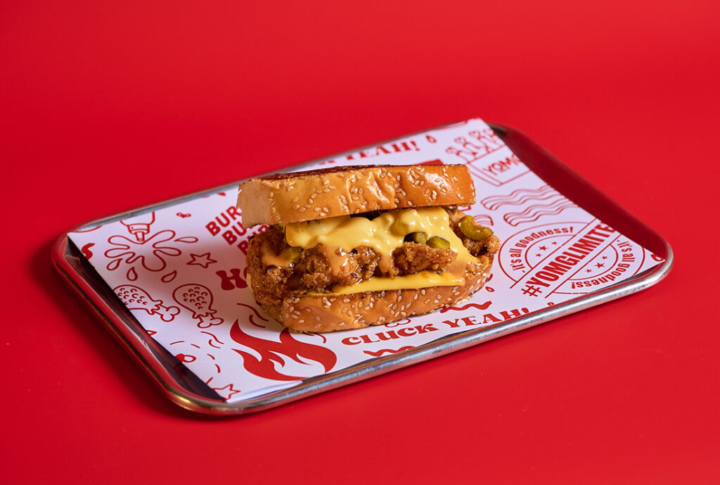 HHCC Texan Toast ~ garlic buttered texan toast, hot honey crunch chick'n tender, cheese sauce, jalapenos, honey sriracha mayo